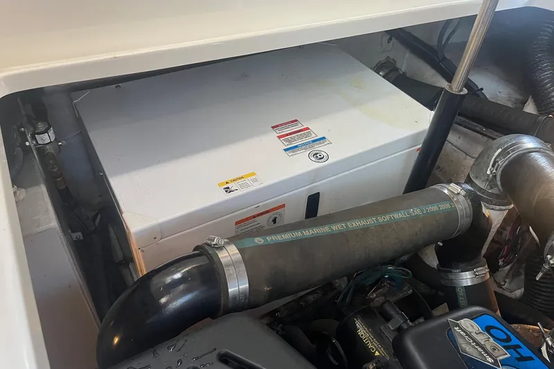 Sonship Yacht Photos Pics Engine compartment of a 2008 Sea Ray 380 Sundancer with visible marine exhaust system.