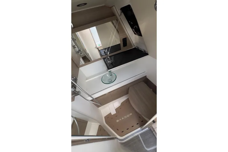  Yacht Photos Pics Interior of 2025 Saxdor 400 GTC boat, featuring modern bathroom design with sink and mirror.