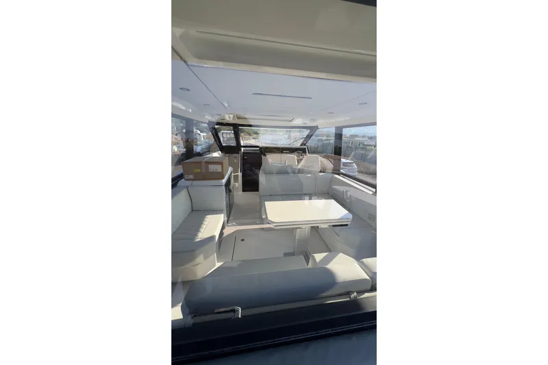  Yacht Photos Pics Interior of 2025 Saxdor 400 GTC yacht, featuring modern seating and sleek design.