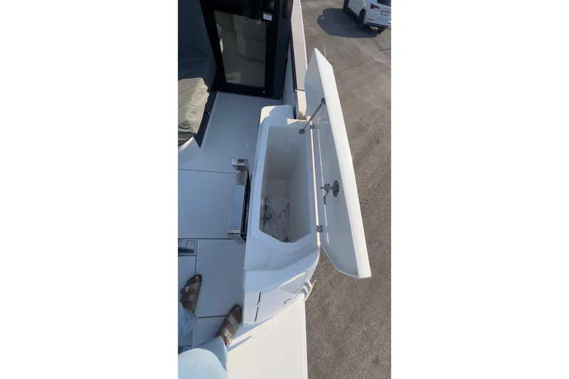  Yacht Photos Pics 2025 Saxdor 400 GTC boat deck with open storage compartment.