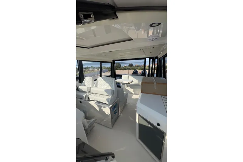  Yacht Photos Pics Interior of 2025 Saxdor 400 GTC boat with modern seating and sleek design.