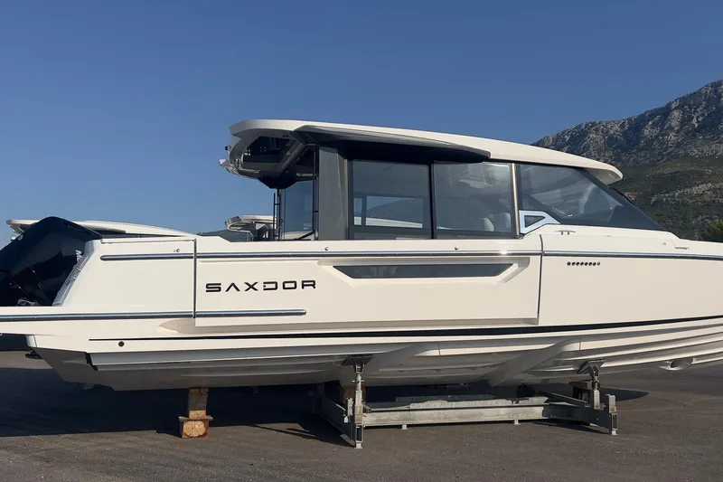  Yacht Photos Pics 2025 Saxdor 400 GTC boat on display with scenic mountain backdrop.