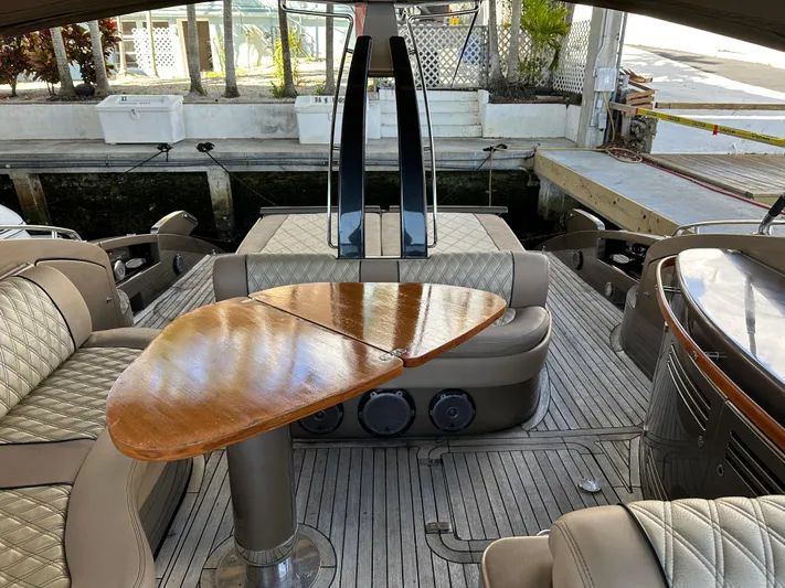  Yacht Photos Pics Luxurious 2005 Riva 52 Rivale yacht interior with elegant seating and wooden table.