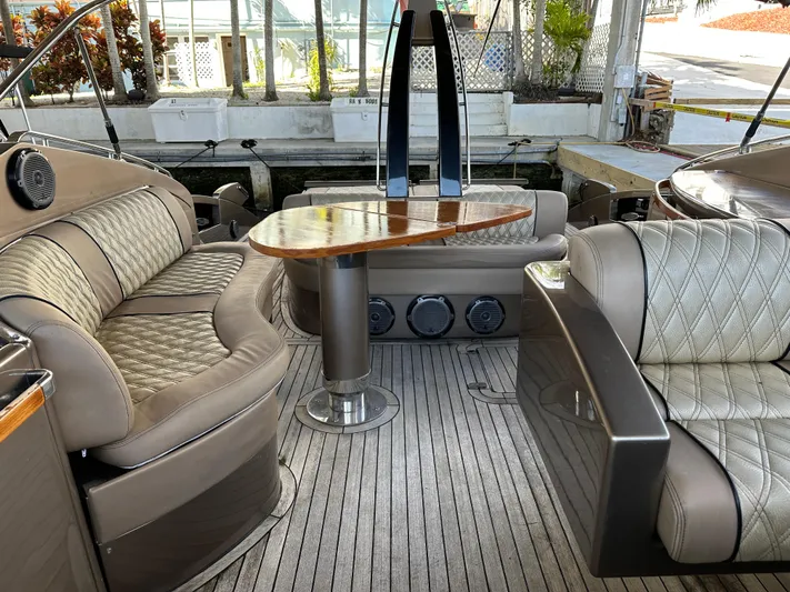  Yacht Photos Pics Luxurious interior of 2005 Riva 52 Rivale yacht with elegant seating and wooden table.