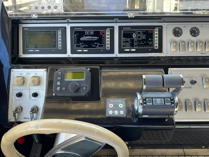  Yacht Photos Pics Control panel of a 2005 Riva 52 Rivale yacht, featuring navigation and throttle systems.