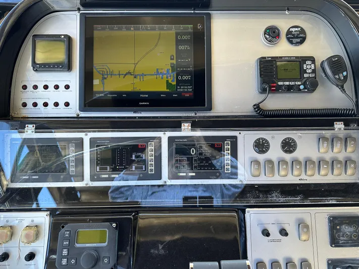  Yacht Photos Pics Control panel of a 2005 Riva 52 Rivale yacht with navigation and communication equipment.