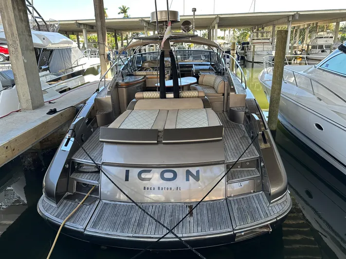  Yacht Photos Pics 2005 Riva 52 Rivale yacht docked, featuring luxurious seating and sleek design.