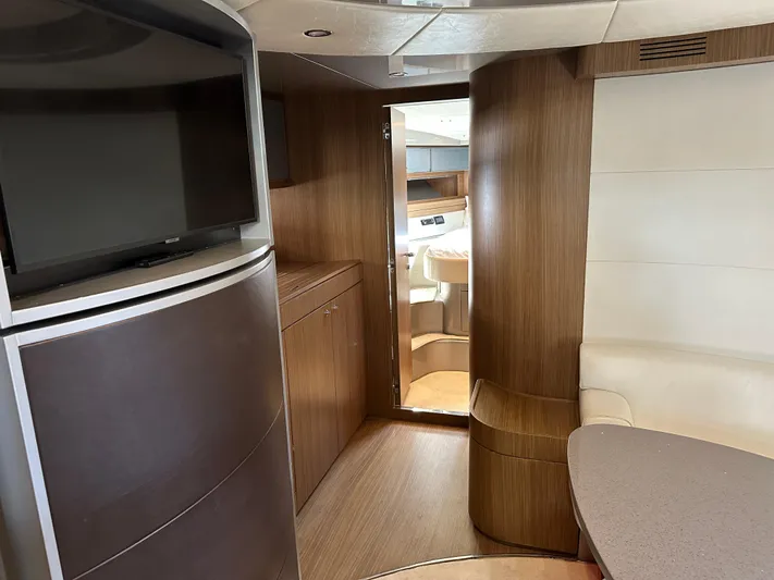  Yacht Photos Pics Interior of 2005 Riva 52 Rivale yacht with modern wood finish and seating area.