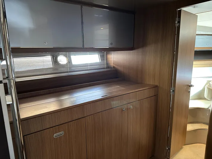  Yacht Photos Pics Interior of 2005 Riva 52 Rivale yacht with wooden cabinetry and modern design.