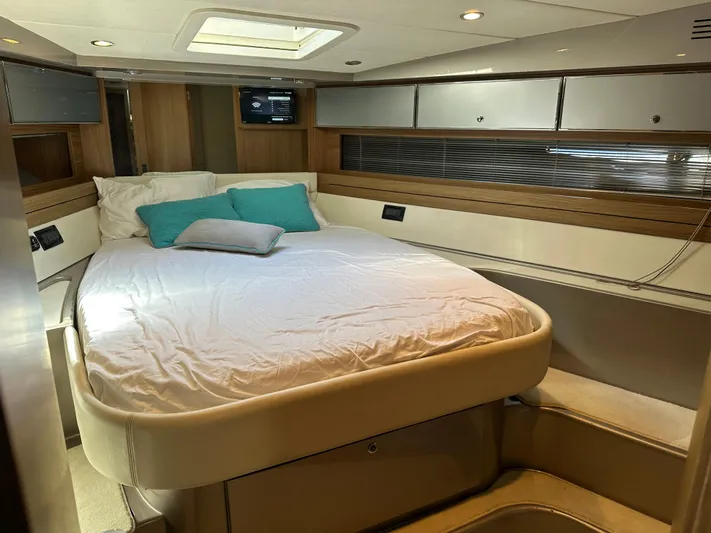  Yacht Photos Pics Luxurious cabin interior of 2005 Riva 52 Rivale yacht with cozy bed and modern design.