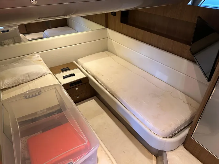  Yacht Photos Pics Interior cabin of 2005 Riva 52 Rivale yacht with twin beds and modern decor.