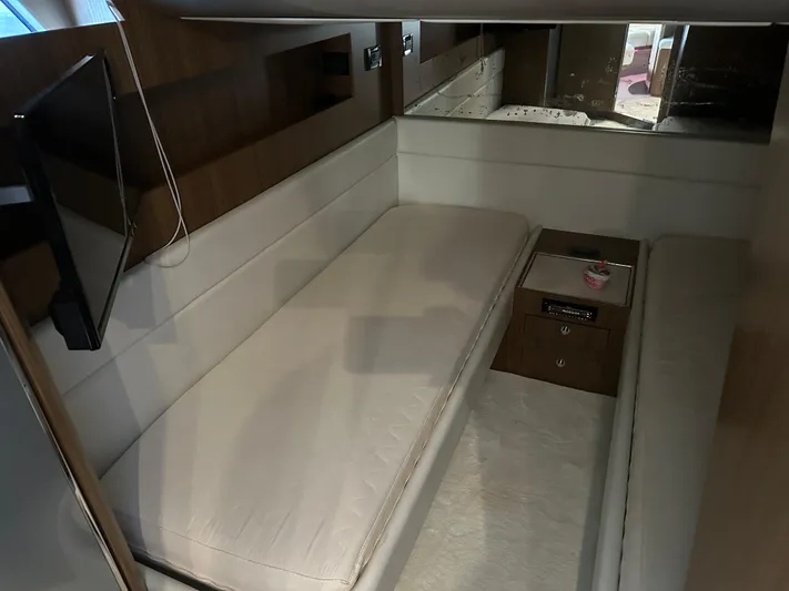  Yacht Photos Pics Interior cabin of 2005 Riva 52 Rivale yacht with modern furnishings and TV.