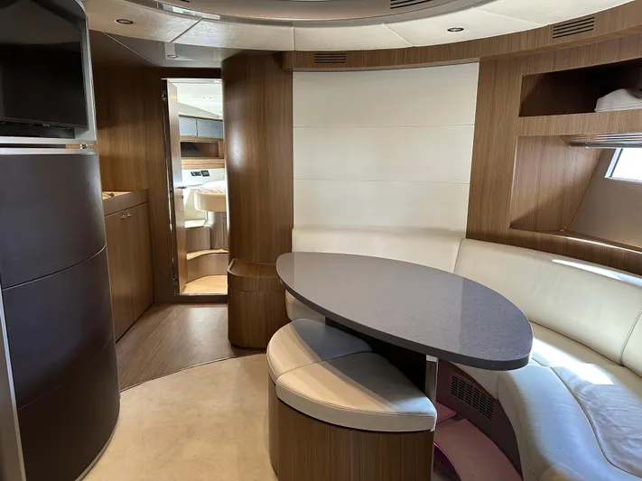  Yacht Photos Pics Interior of 2005 Riva 52 Rivale yacht with elegant wood and leather seating.