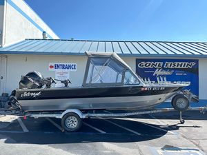 2008 Jetcraft 1925 Adventurer boat on trailer outside fishing store.