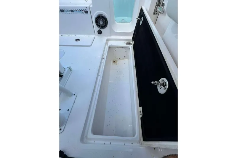  Yacht Photos Pics 2024 Sea Fox 268 Commander boat storage compartment with open lid and speaker.