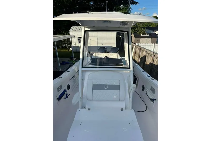  Yacht Photos Pics 2024 Sea Fox 268 Commander boat interior with seating and console.