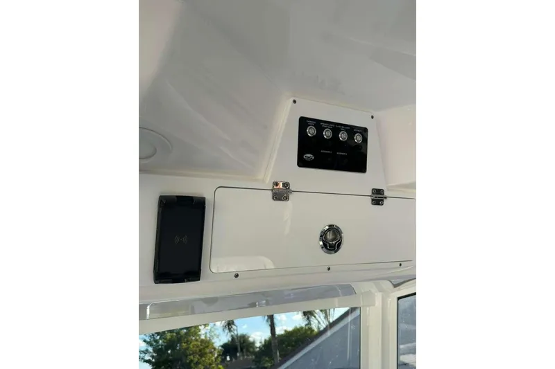  Yacht Photos Pics 2024 Sea Fox 268 Commander dashboard with control panel and storage compartment.