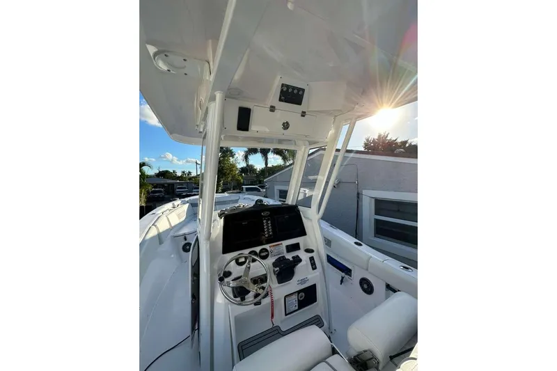  Yacht Photos Pics 2024 Sea Fox 268 Commander boat interior with steering wheel and control panel.