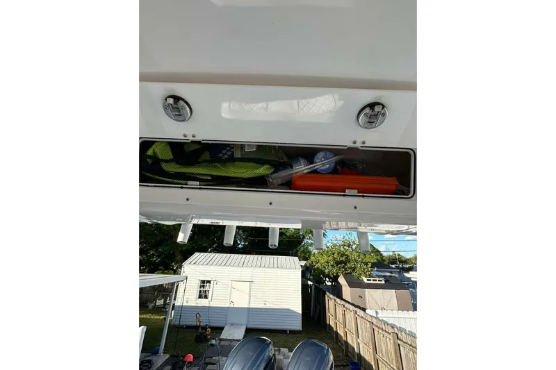  Yacht Photos Pics 2024 Sea Fox 268 Commander storage compartment with gear, outdoor setting in background.