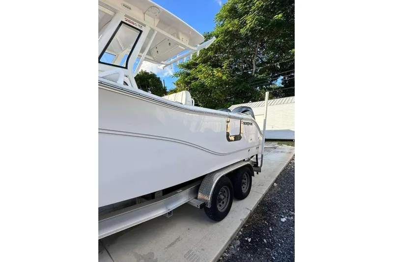 Yacht Photos Pics 2024 Sea Fox 268 Commander boat on trailer, parked outdoors.