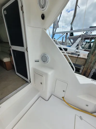  Yacht Photos Pics 2002 Riviera 37 Convertible yacht interior with dock view and marine equipment.