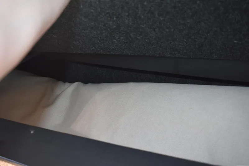  Yacht Photos Pics Interior storage compartment of 2026 Regal 26 XO boat, featuring fabric lining.