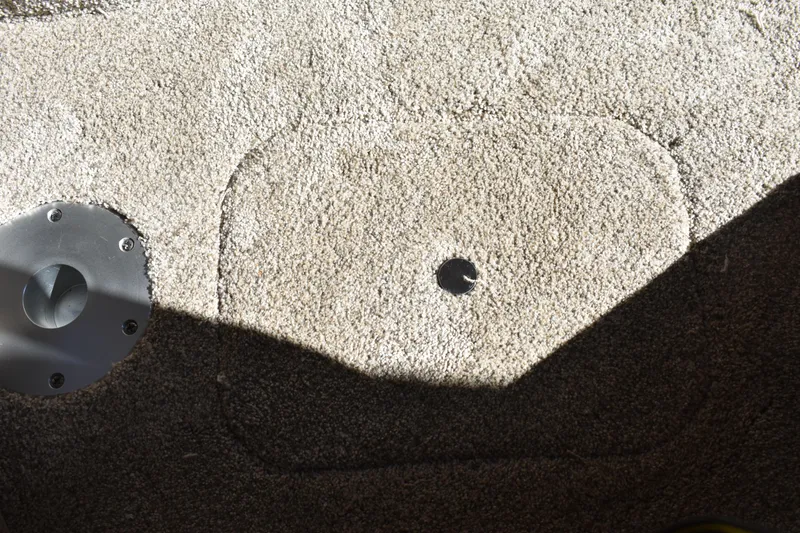  Yacht Photos Pics Carpeted floor detail of 2026 Regal 26 XO boat with metal fixture.