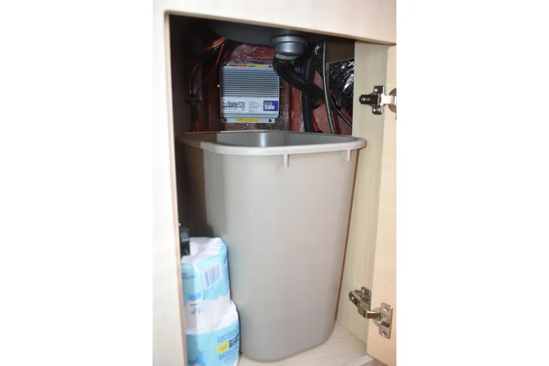  Yacht Photos Pics Storage compartment in 2026 Regal 26 XO boat with trash bin and supplies.