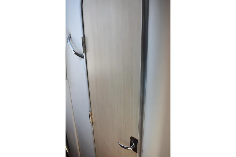  Yacht Photos Pics 2026 Regal 26 XO cabin door with sleek handle and modern design.