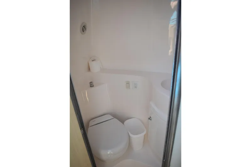 Yacht Photos Pics 2026 Regal 26 XO boat bathroom interior with toilet and compact design.