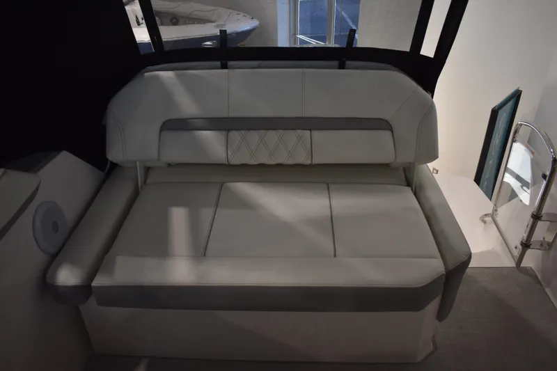  Yacht Photos Pics 2026 Regal 26 XO boat interior with cushioned seating and modern design.