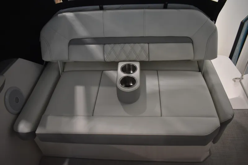  Yacht Photos Pics 2026 Regal 26 XO boat interior with cushioned seating and built-in cup holders.