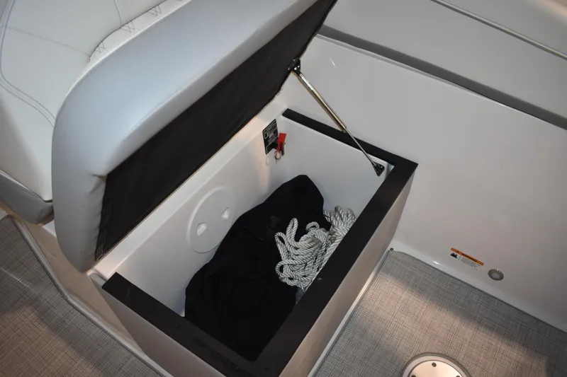  Yacht Photos Pics Storage compartment on 2026 Regal 26 XO boat with rope and black cover.