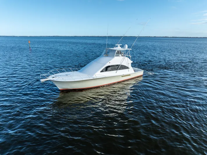  Yacht Photos Pics 2006 Ocean 57 yacht on calm blue waters under clear sky.
