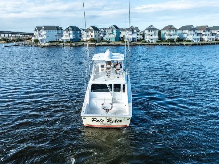  Yacht Photos Pics Ocean 57 yacht from 2006 on water, with coastal homes in the background.