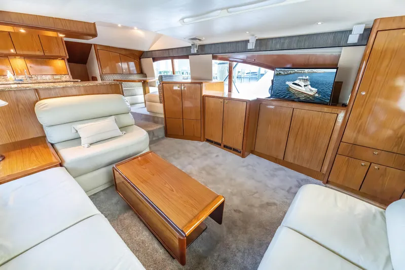  Yacht Photos Pics Luxurious 2006 Ocean 57 yacht interior with elegant wood finishes and comfortable seating.