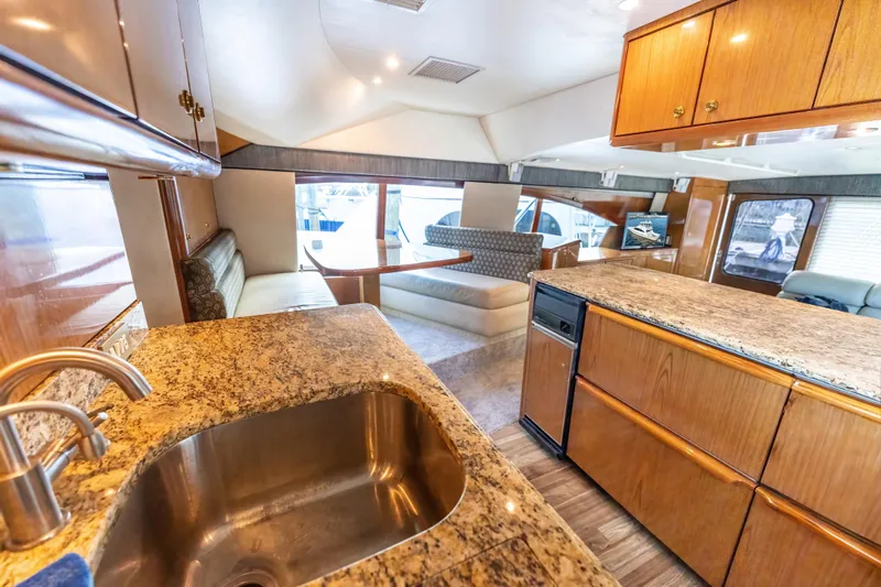 Yacht Photos Pics Luxurious 2006 Ocean 57 yacht interior with granite countertops and spacious seating area.
