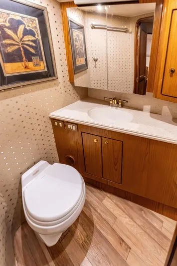  Yacht Photos Pics Luxurious 2006 Ocean 57 yacht bathroom with wood accents and modern fixtures.