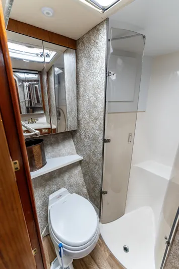  Yacht Photos Pics Luxurious 2006 Ocean 57 yacht bathroom with modern fixtures and elegant design.