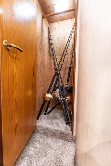  Yacht Photos Pics Fishing rods stored in a wooden closet on a 2006 Ocean 57 boat.