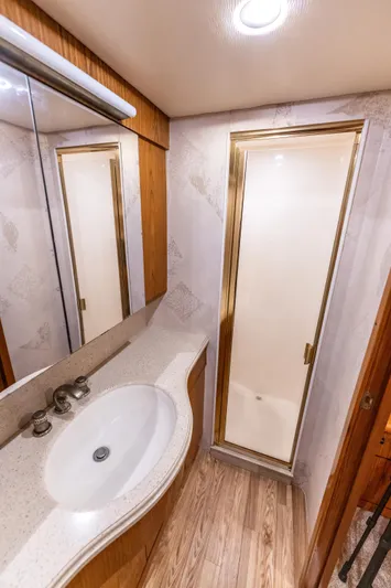  Yacht Photos Pics Luxurious bathroom in 2006 Ocean 57 yacht with modern fixtures and elegant design.