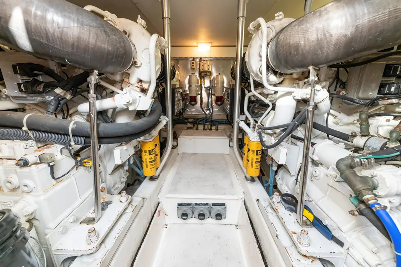  Yacht Photos Pics Engine room of 2006 Ocean 57 yacht, showcasing dual engines and mechanical components.