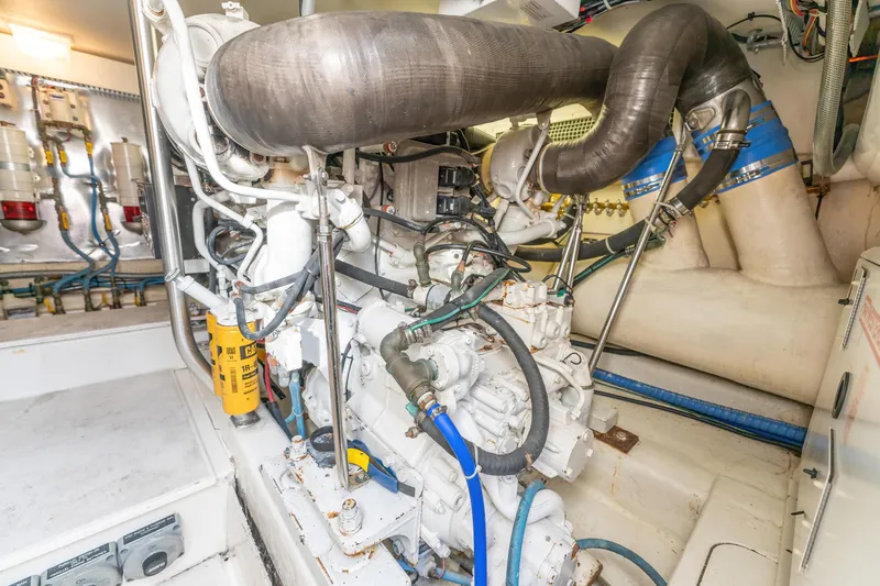  Yacht Photos Pics Engine room of a 2006 Ocean 57 yacht, showcasing mechanical components and piping.