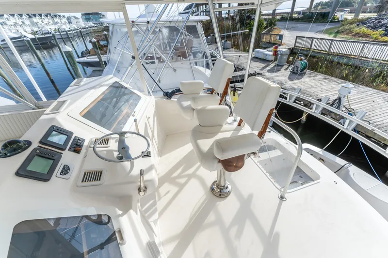  Yacht Photos Pics 2006 Ocean 57 yacht helm with dual captain chairs and navigation equipment.