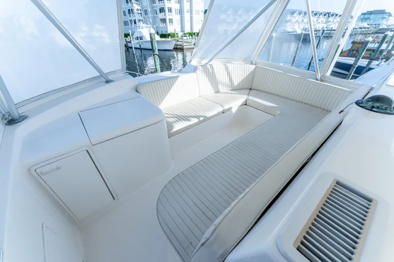  Yacht Photos Pics Luxurious seating area on a 2006 Ocean 57 yacht, docked at a marina.