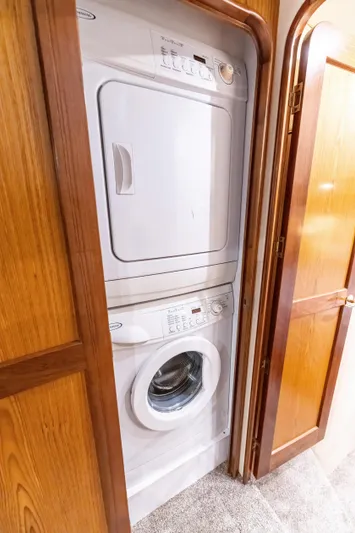  Yacht Photos Pics Stacked washer and dryer in 2006 Ocean 57 yacht interior.