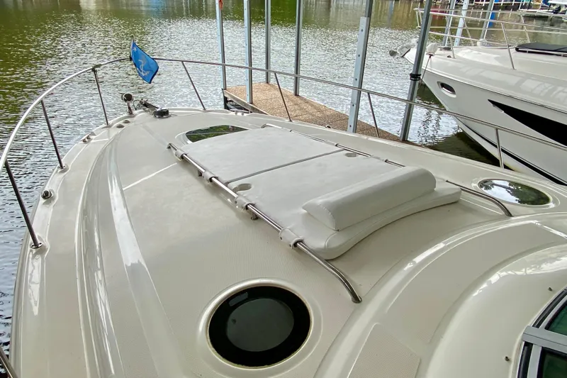  Yacht Photos Pics 2007 Sea Ray 340 Sundancer boat deck with railing and water view.