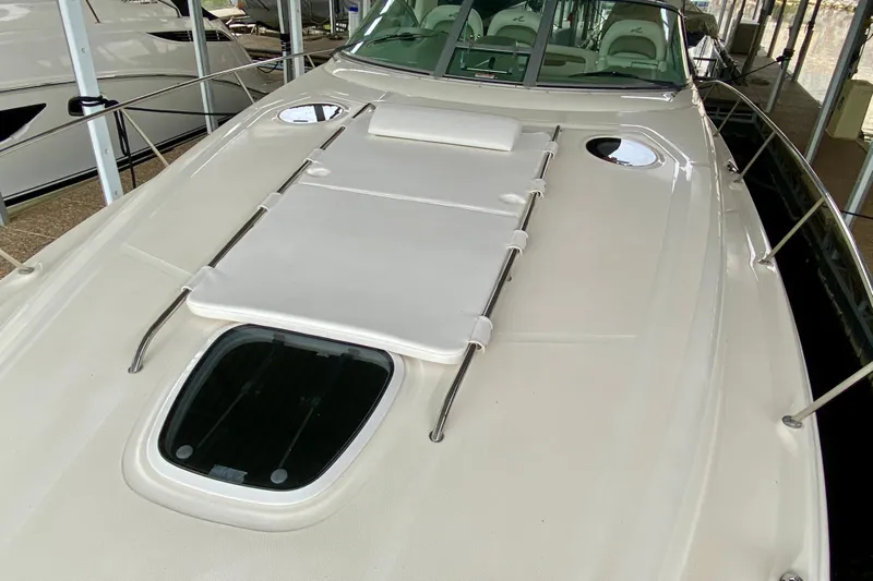  Yacht Photos Pics 2007 Sea Ray 340 Sundancer yacht with sunpad on deck, docked in marina.