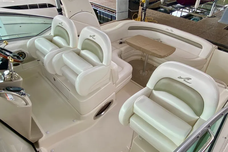  Yacht Photos Pics 2007 Sea Ray 340 Sundancer cockpit with white seating and table.