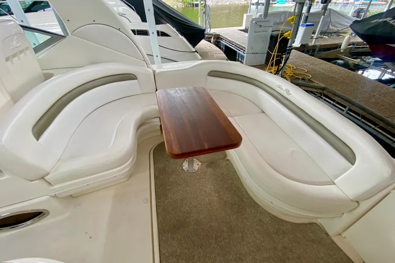  Yacht Photos Pics 2007 Sea Ray 340 Sundancer boat with white seating and wooden table in cockpit area.